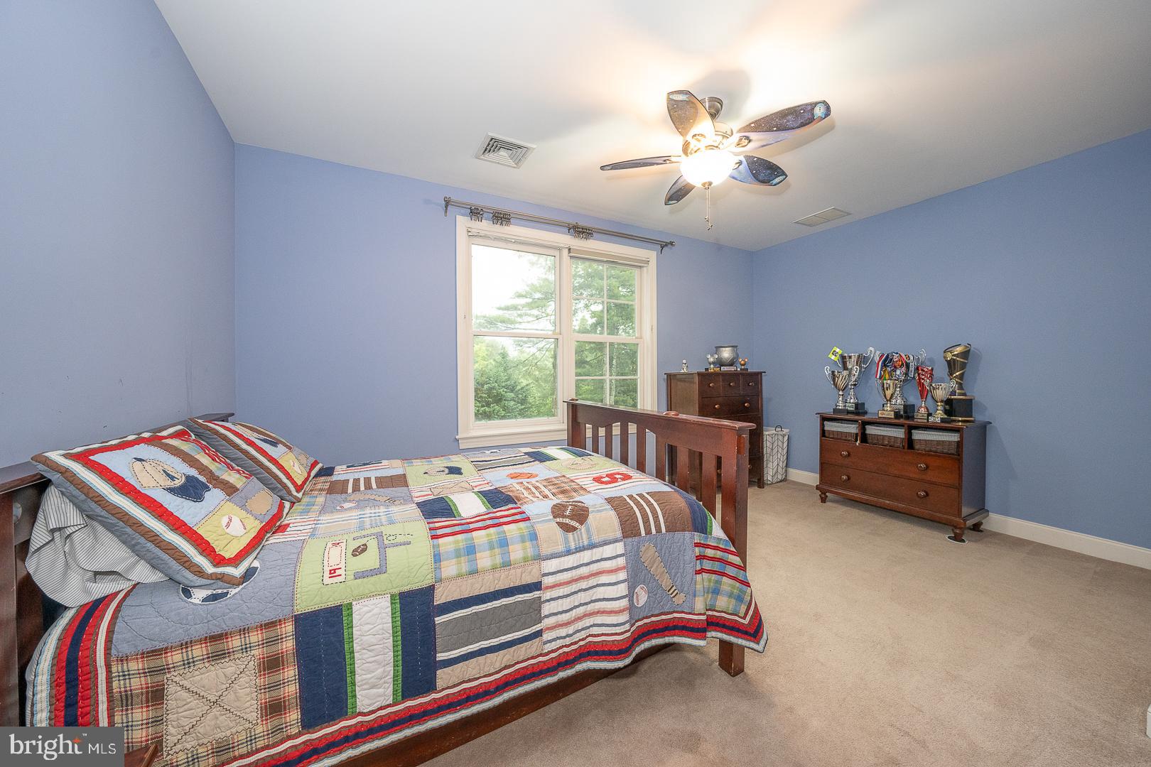 899 Black Rock Road Gladwyne, PA 19035 - Photo 40 of 59 a bedroom with a bed and a chandelier