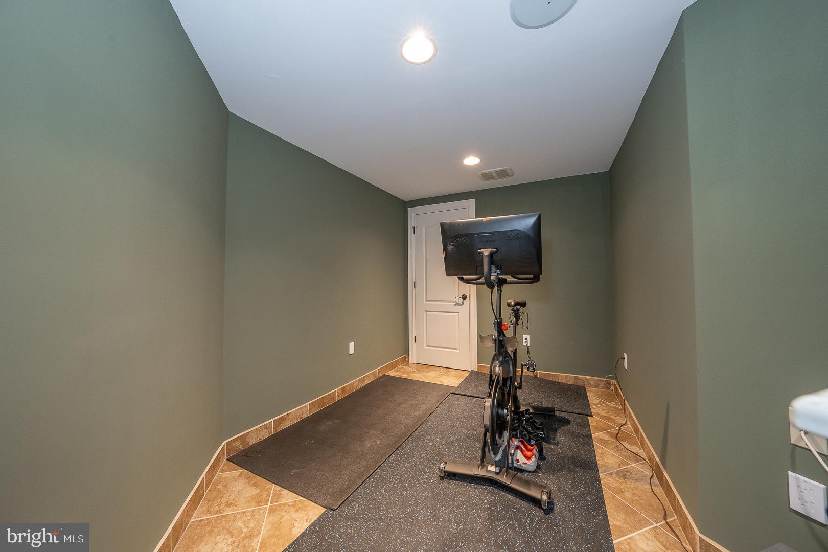 899 Black Rock Road Gladwyne, PA 19035 - Photo 52 of 59 a room with gym equipment and a table