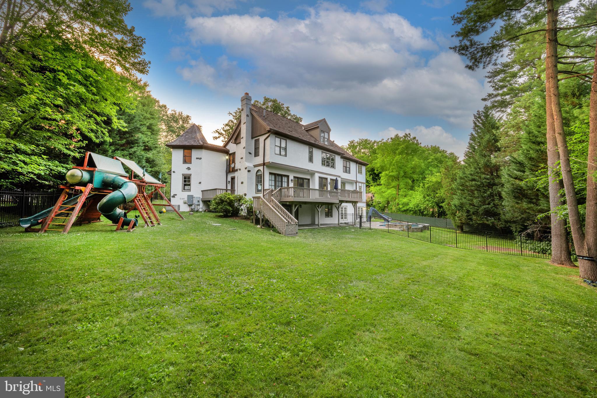 899 Black Rock Road Gladwyne, PA 19035 - Photo 55 of 59 a view of a house with a big yard and large trees