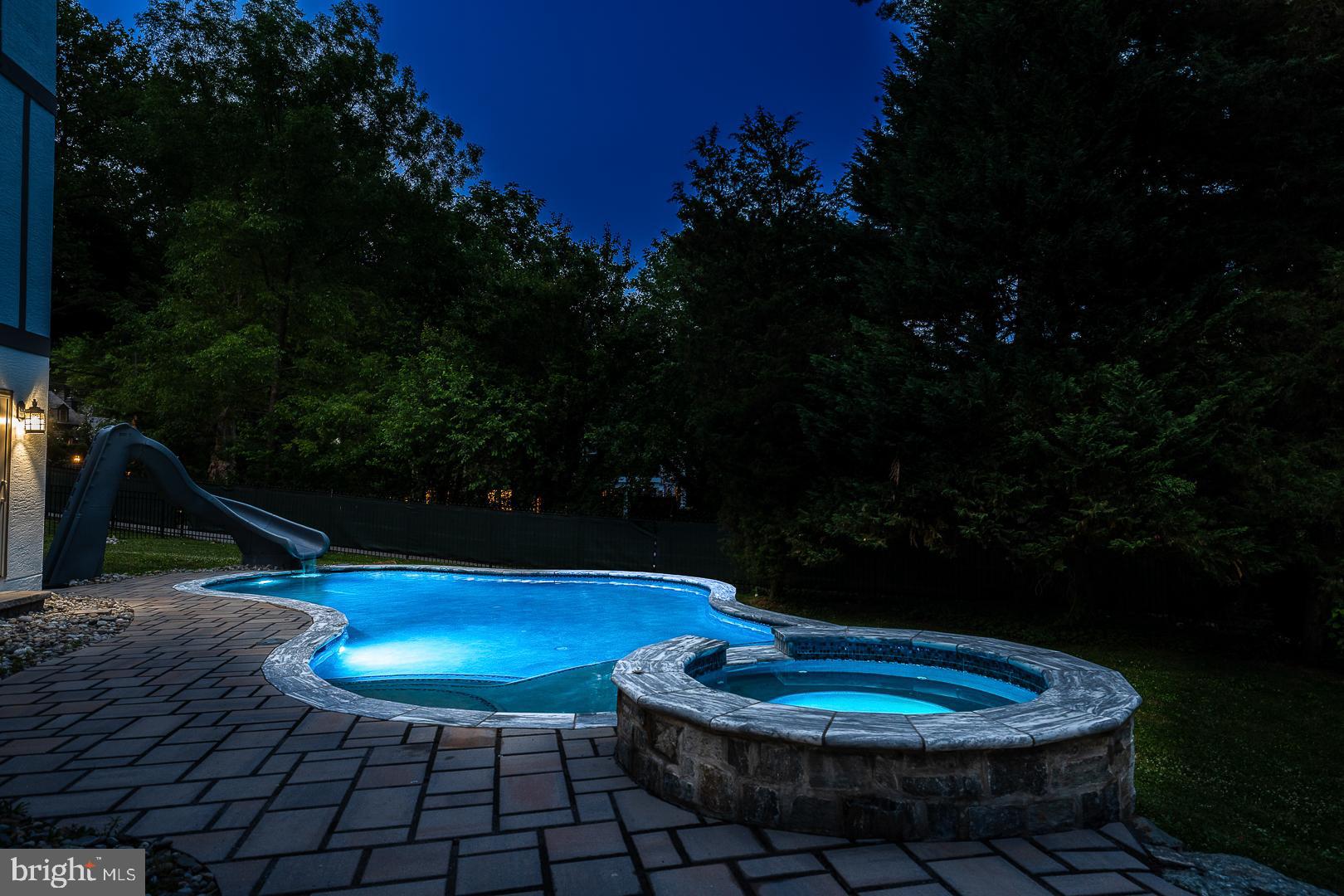 899 Black Rock Road Gladwyne, PA 19035 - Photo 56 of 59 a swimming pool with some potted plants and trees