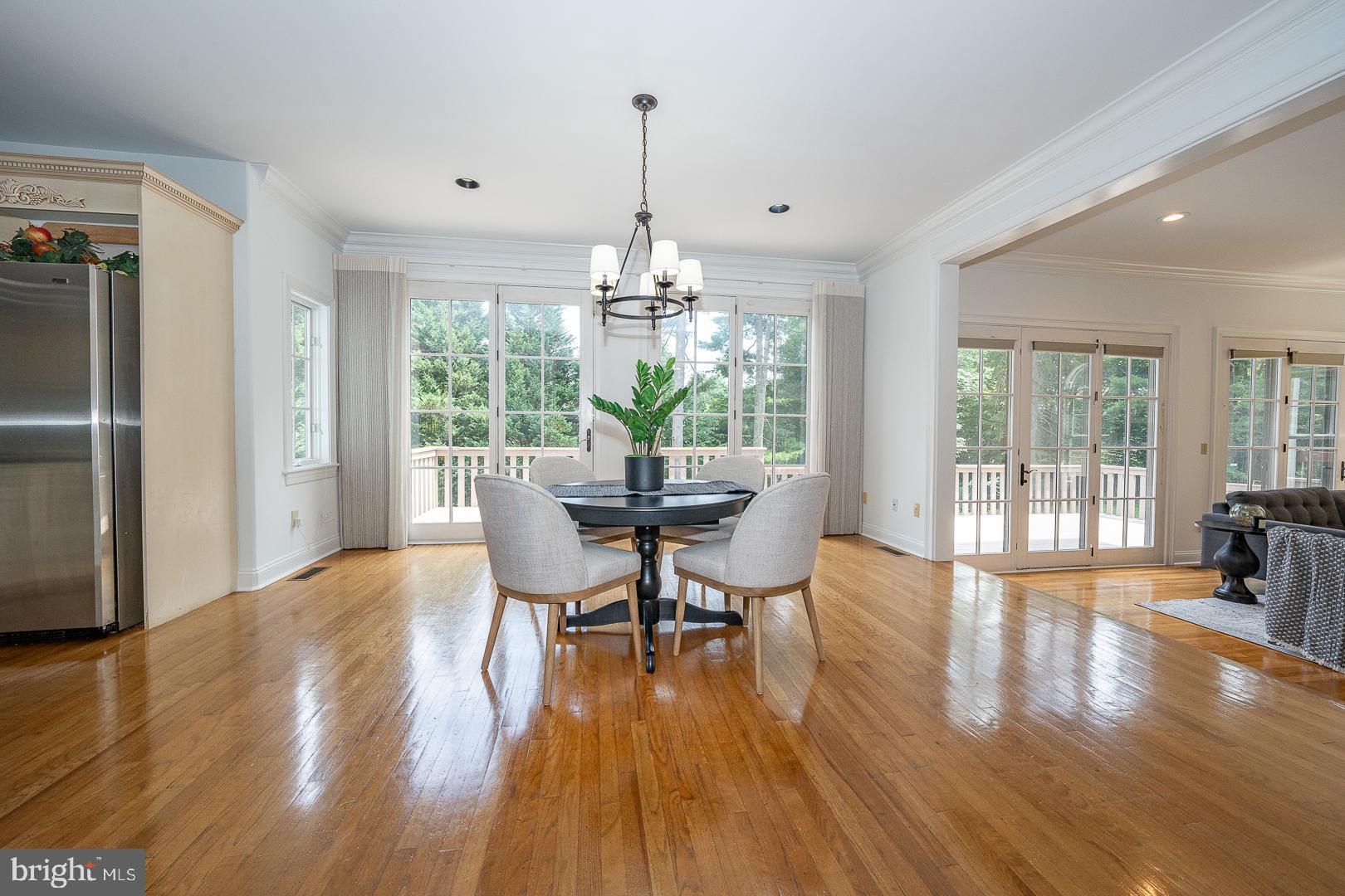 899 Black Rock Road Gladwyne, PA 19035 - Photo 10 of 59 a view of a dining room with furniture wooden floor and chandelier