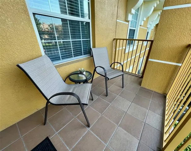 a bedroom with bed and a chandelier