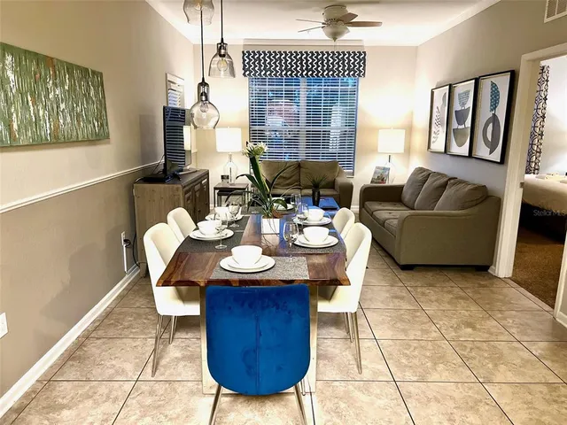 a living room with furniture a window and a table