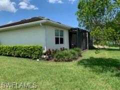 14631 Edgewater Circle Naples, FL 34114 - Photo 2 of 16 a view of a house with a yard