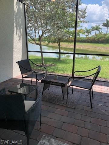 14631 Edgewater Circle Naples, FL 34114 - Photo 4 of 16 a view of outdoor space with seating area and trees