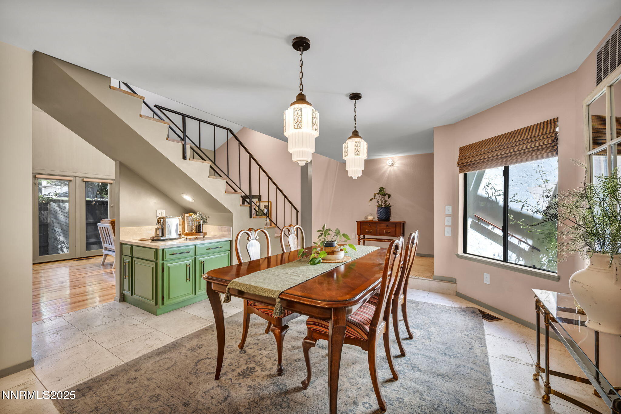 4307 Clyde Court Reno, NV 89509 - Photo 20 of 83 a dining room with furniture a chandelier and wooden floor