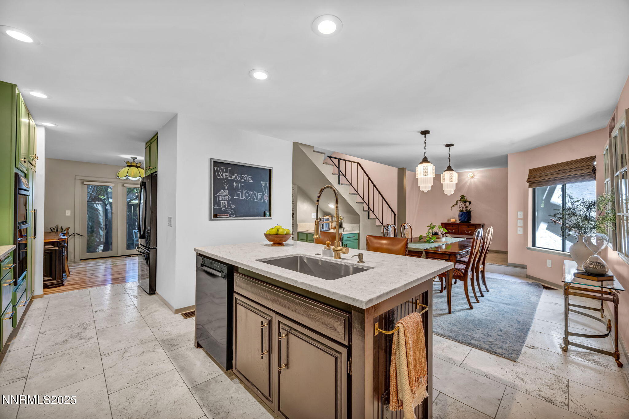 4307 Clyde Court Reno, NV 89509 - Photo 23 of 83 a kitchen with a stove a refrigerator and a dining table