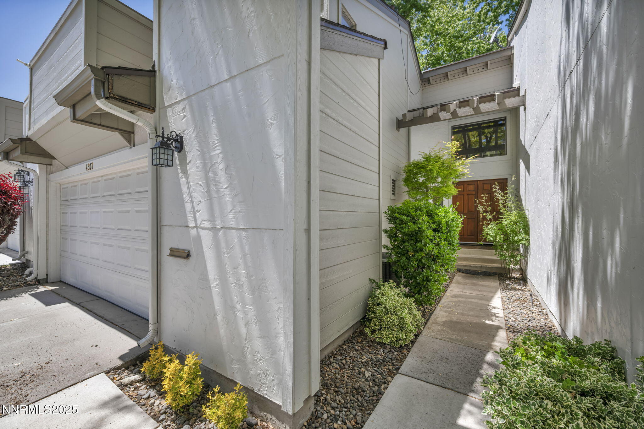 4307 Clyde Court Reno, NV 89509 - Photo 4 of 83 a view of a pathway with a flower plants