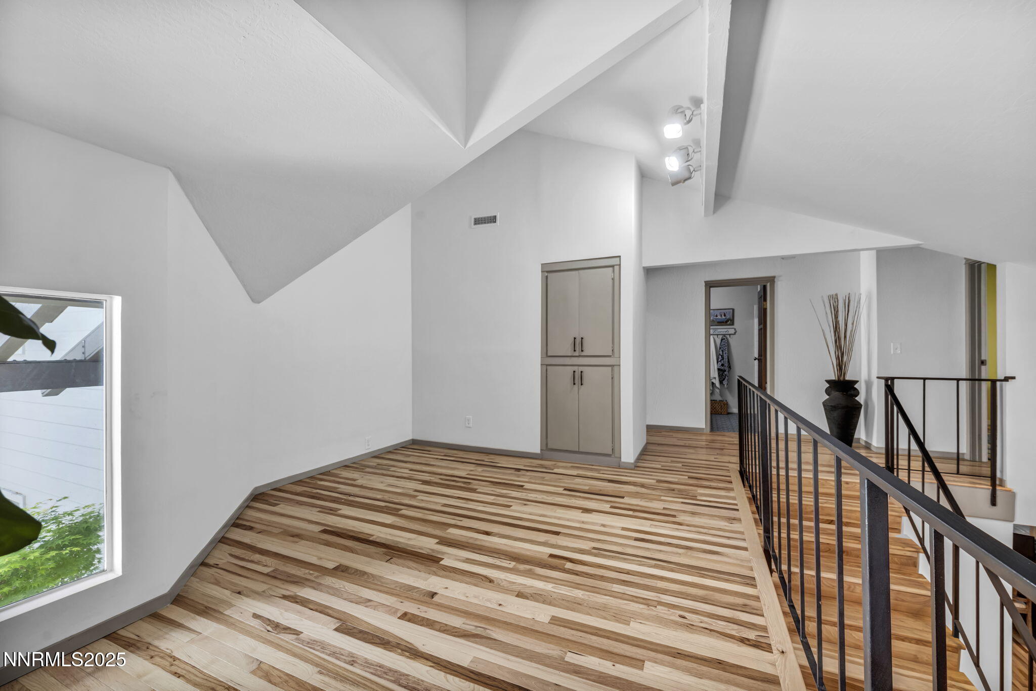 4307 Clyde Court Reno, NV 89509 - Photo 41 of 83 a view of a hallway with wooden floor and staircase