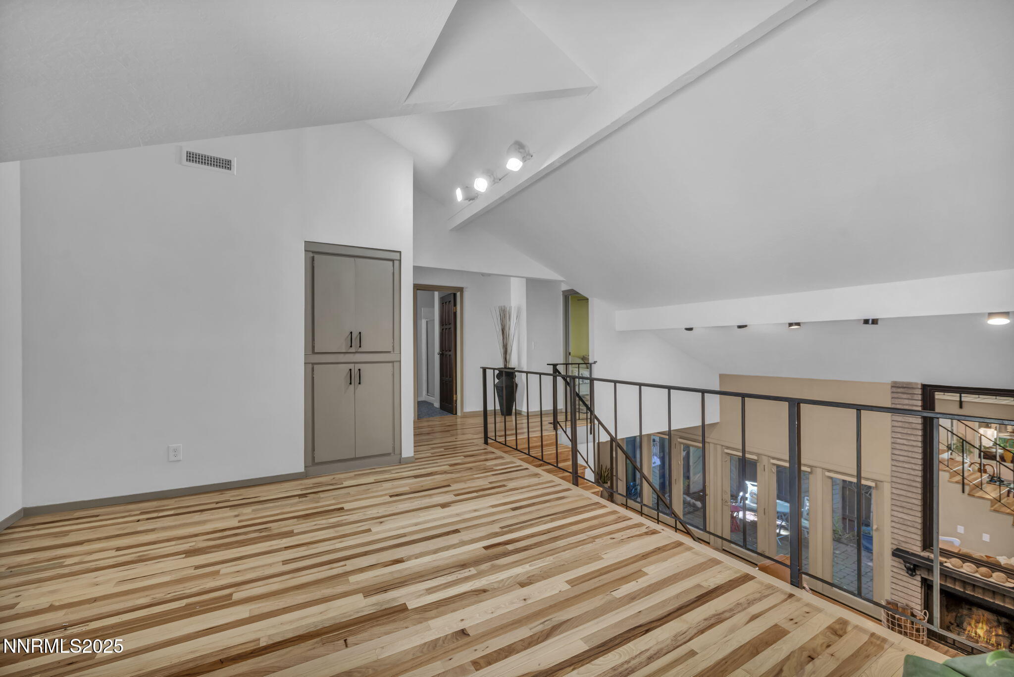 4307 Clyde Court Reno, NV 89509 - Photo 42 of 83 a view of a hallway with wooden floor and staircase