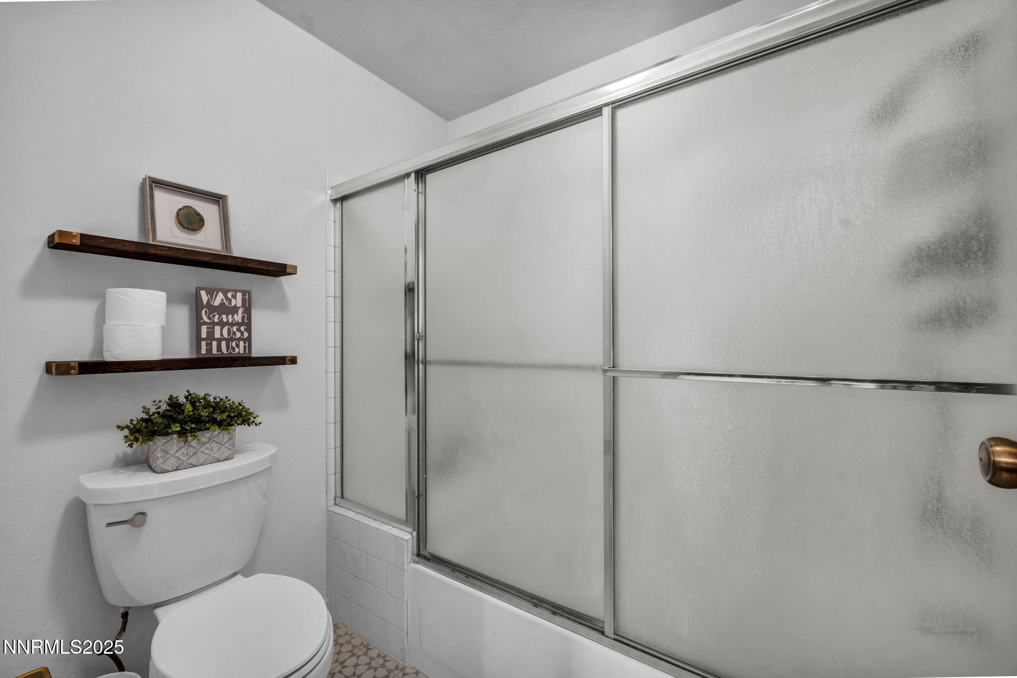 4307 Clyde Court Reno, NV 89509 - Photo 57 of 83 a white toilet sitting next to a bathroom sink