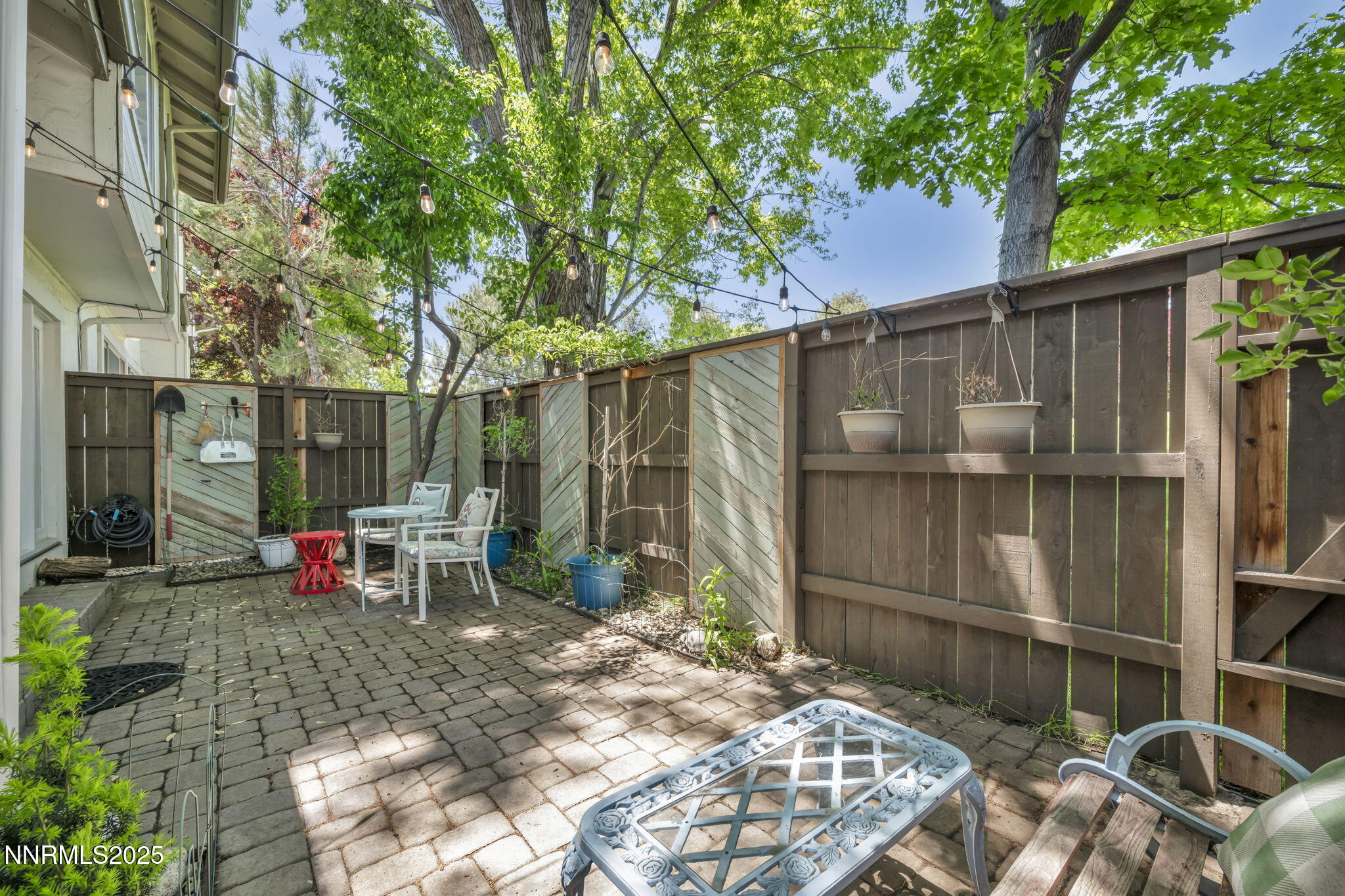 4307 Clyde Court Reno, NV 89509 - Photo 61 of 83 a view of backyard with table and chairs and a large tree