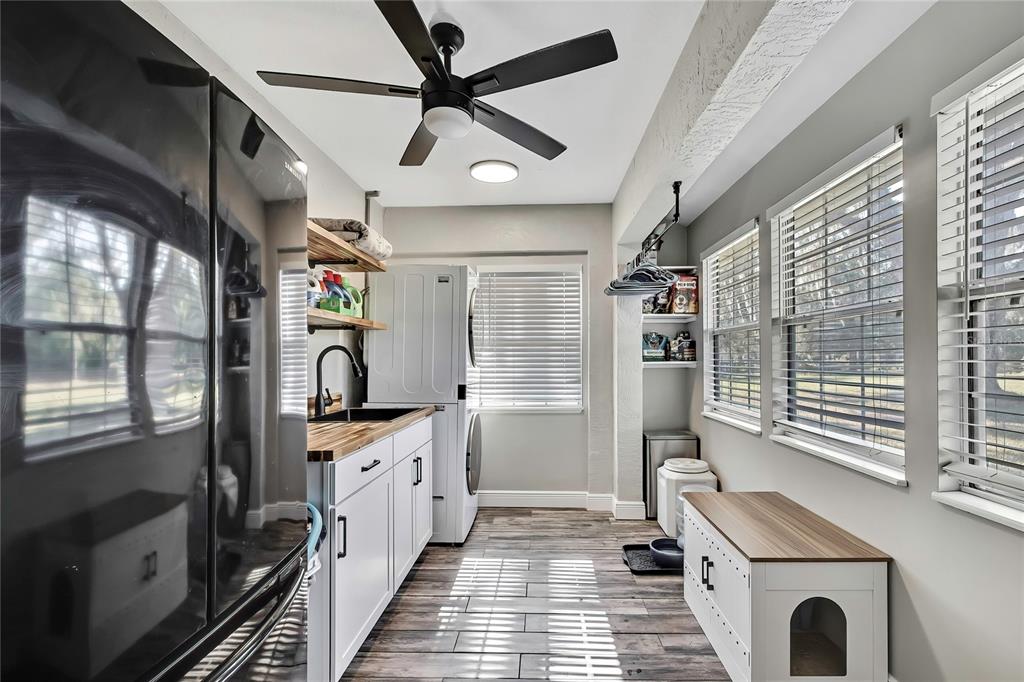 11419 Old Crystal River Road Brooksville, FL 34601 - Photo 43 of 89 a kitchen with granite countertop a stove a sink and a refrigerator