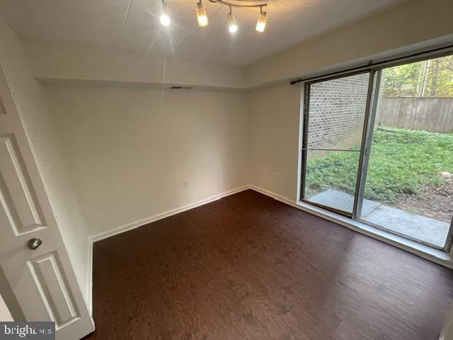 3346 Hewitt Avenue, Unit 11A Silver Spring, MD 20906 - Photo 13 of 16 a view of room with window and wooden floor