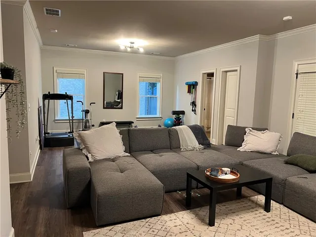 a view of entryway with wooden floor and stairs