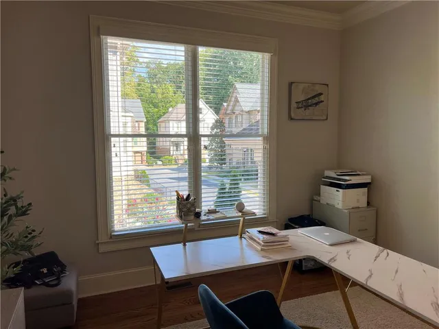 a fireplace with a vase and flowers in it