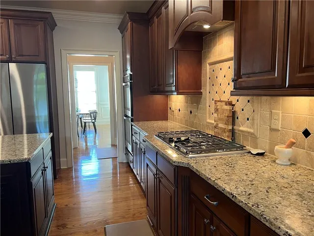 a bedroom with a bed lamp and a window