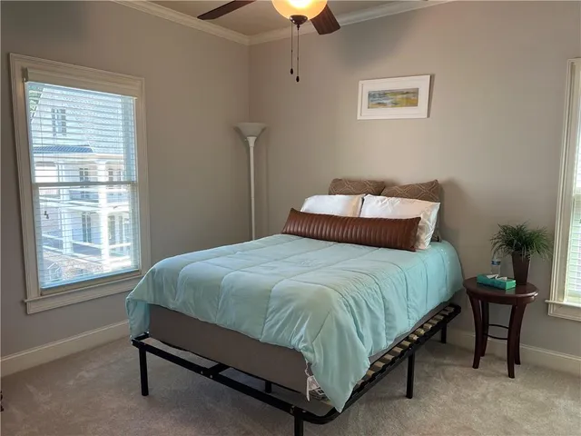 a spacious bathroom with a granite countertop tub shower and sink