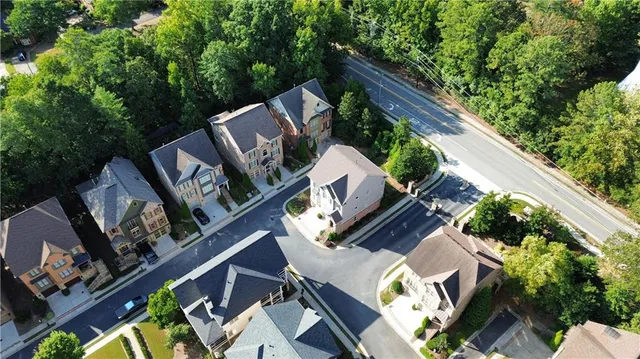 a view of a park with large trees