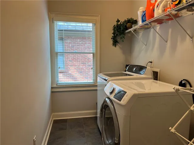 a table and chairs in front of a house