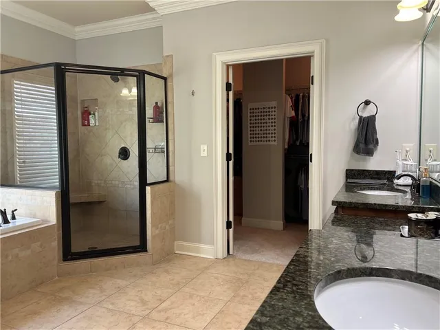 an aerial view of residential house and green space