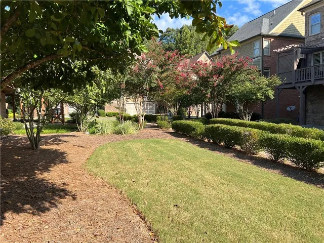a bathroom with a sink toilet and a mirror