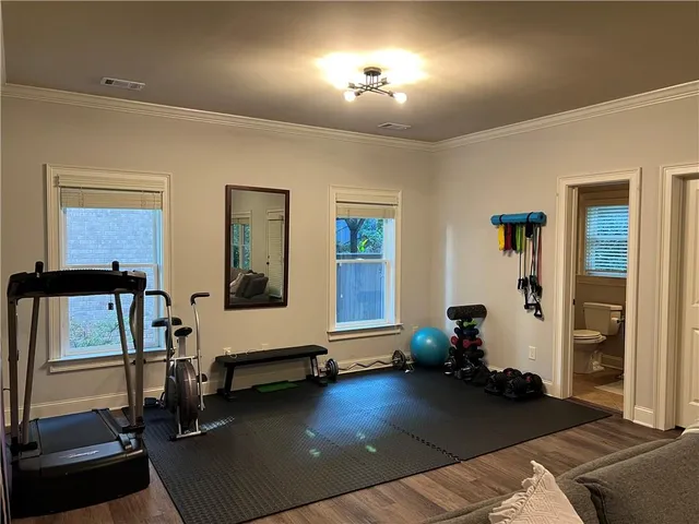 a view of entryway with wooden floor and door