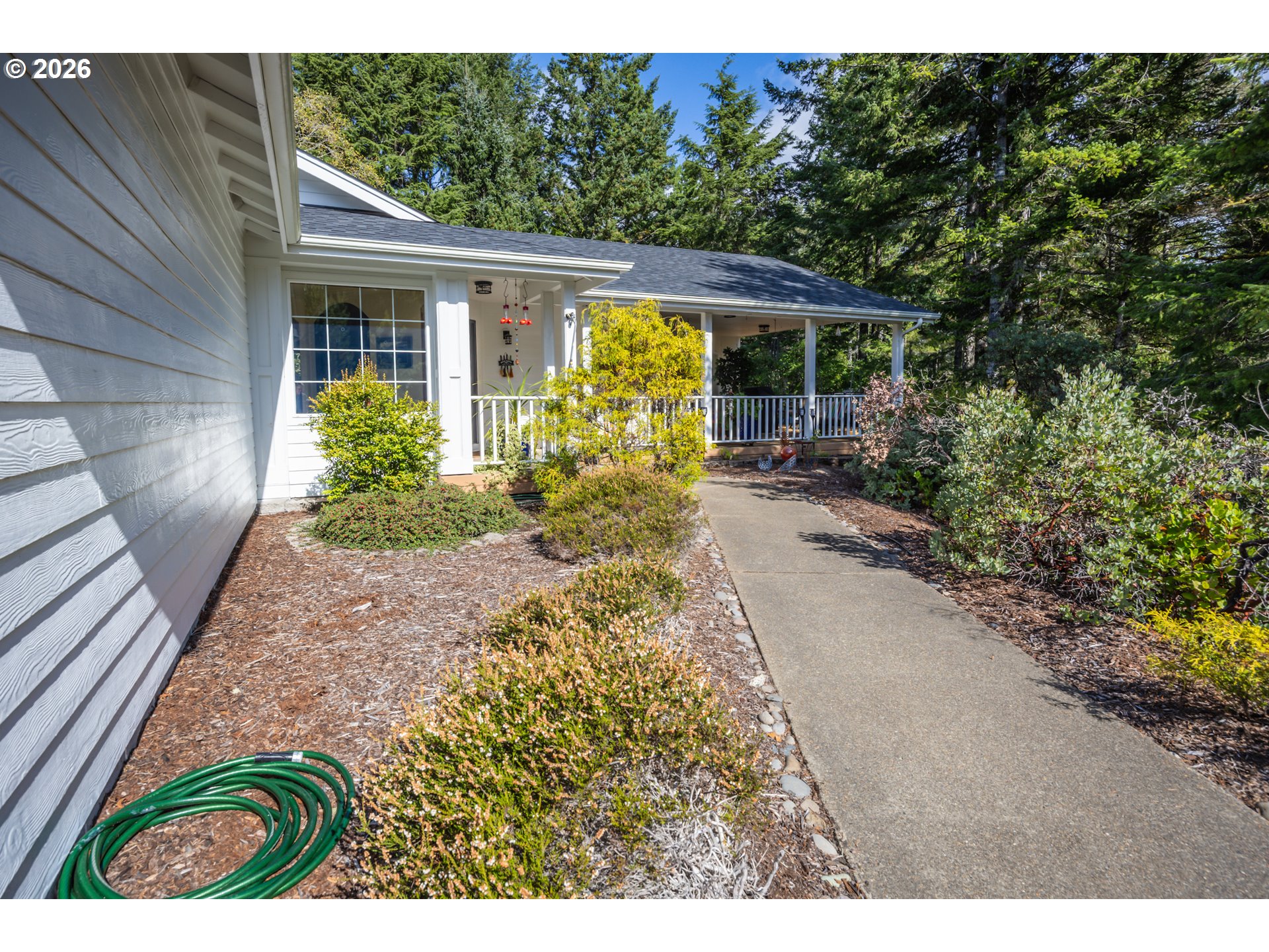 2193 13th Street Florence, OR 97439 - Photo 2 of 48 a front view of house with garden