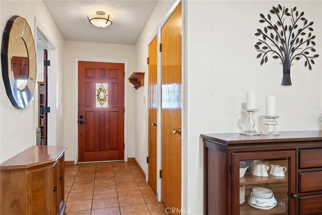 a view of livingroom with furniture and front door