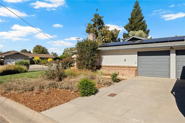 a view of a yard and front view of a house
