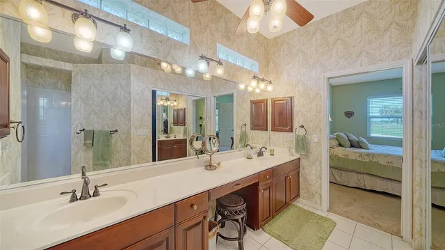 a bedroom with a bed and glass window