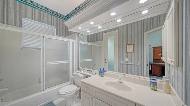 a view of a house with balcony and yard