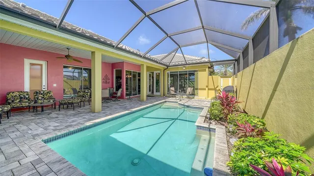 a view of a dinning room with furniture and floor to ceiling window