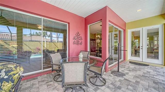 a living room with furniture kitchen and a chandelier