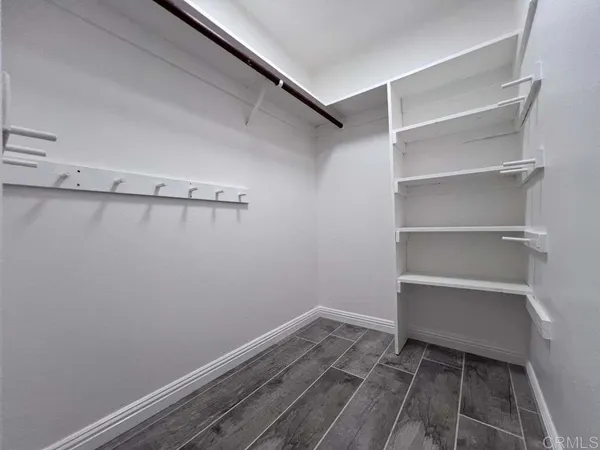 a room with an empty walk in closet