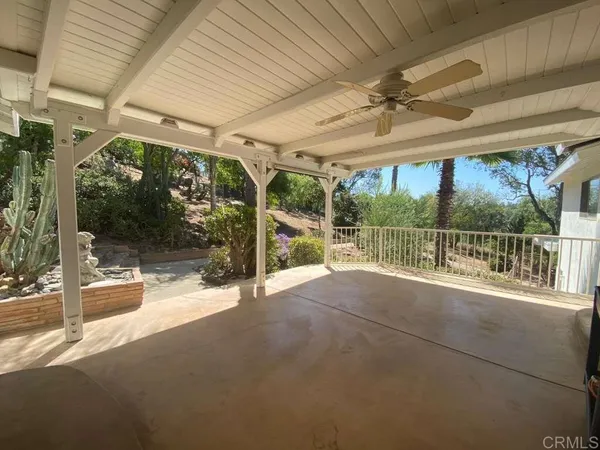 a view of an empty room with a balcony