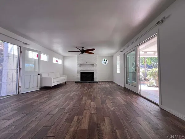 a view empty room with window and chandelier fan