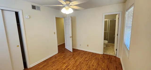 wooden floor in an empty room with a mirror