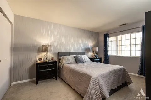 a bedroom with bed and window