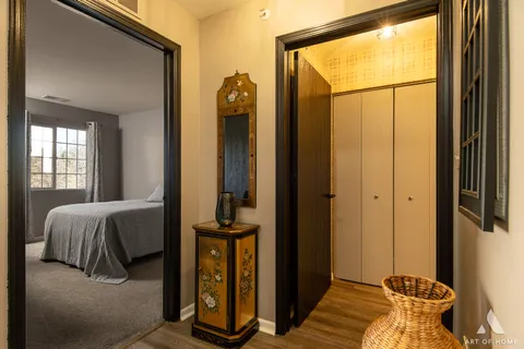 a bedroom with a bed and a mirror