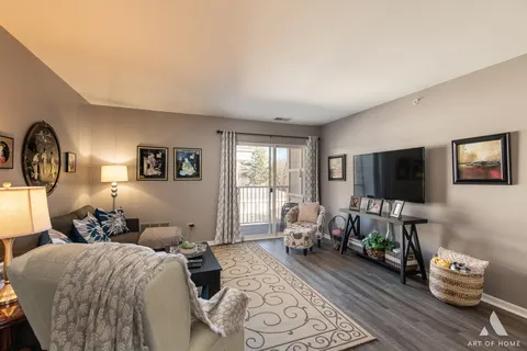 a bedroom with furniture and a flat screen tv
