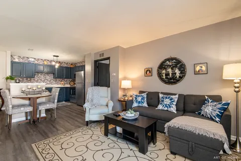 a living room with furniture and a table