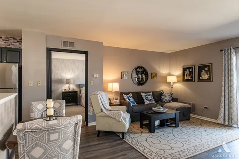 a living room with furniture and a table