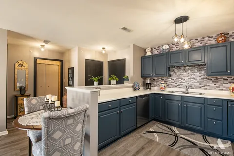 a kitchen with a sink and cabinets