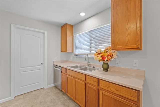 a kitchen with a sink and a window