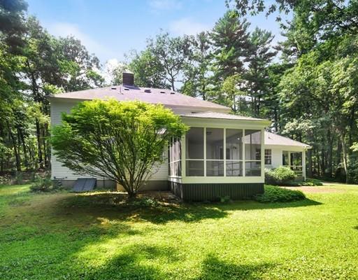 256 Hunters Ridge Road Concord, MA 01742 - Photo 13 of 16 a view of a house with a yard