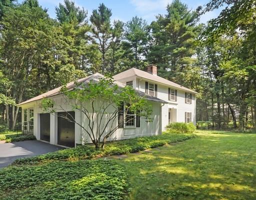 256 Hunters Ridge Road Concord, MA 01742 - Photo 15 of 16 a front view of a house with a yard and garage