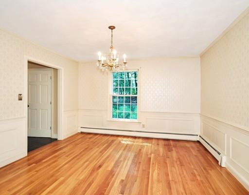 256 Hunters Ridge Road Concord, MA 01742 - Photo 4 of 16 a view of an empty room with wooden floor and a window