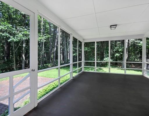 256 Hunters Ridge Road Concord, MA 01742 - Photo 8 of 16 a view of an empty room with large windows and a balcony
