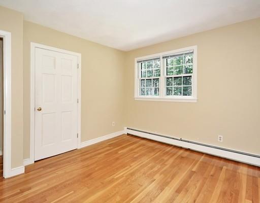 256 Hunters Ridge Road Concord, MA 01742 - Photo 10 of 16 an empty room with wooden floor and windows